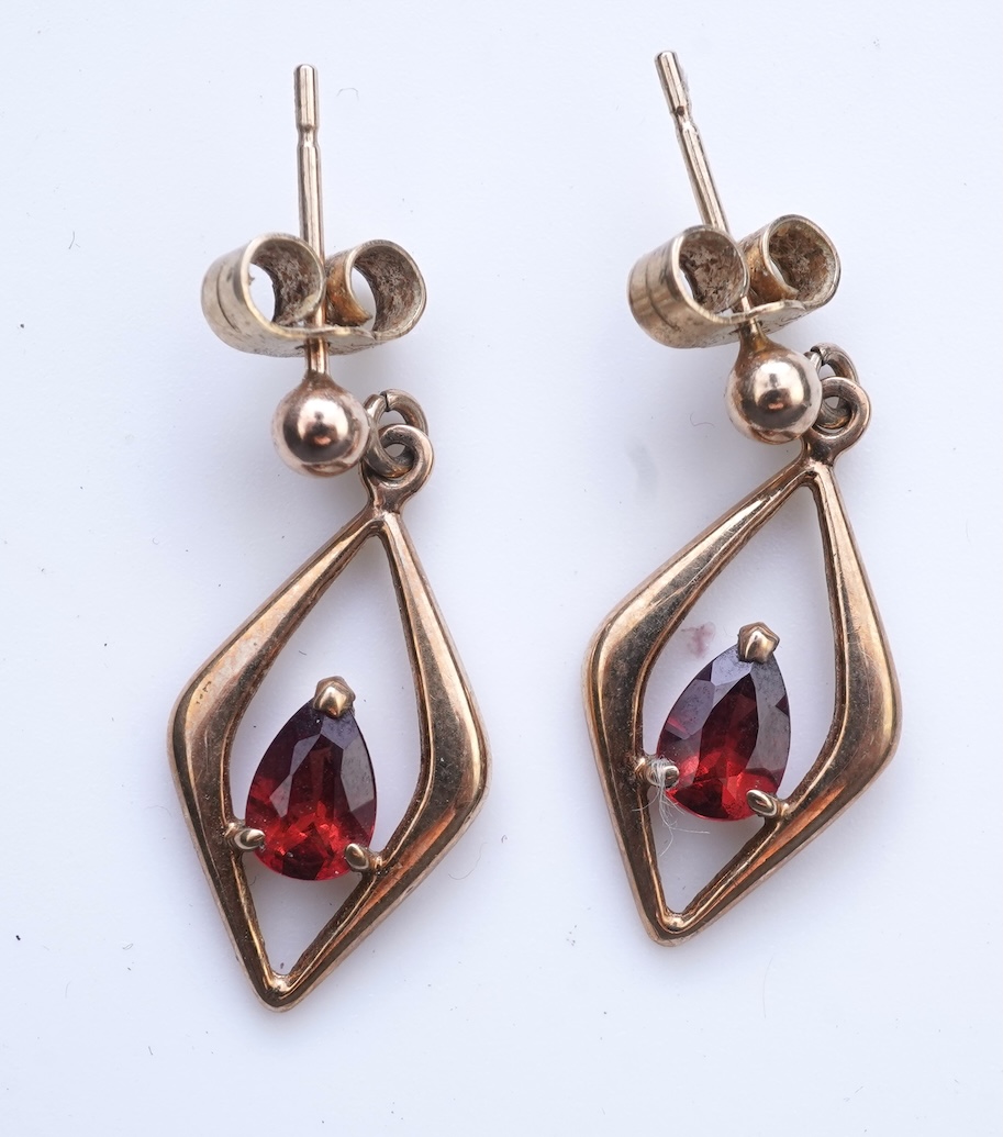 Eight pairs of earrings and pendant, comprising: a pair of onyx studs; a pair of emerald studs; a pair of sapphire and diamond drop earrings; a pair of opal drop earrings; a pair of garnet drop earrings; and a shell pend